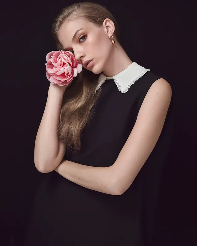 Portrait of a woman with a rose