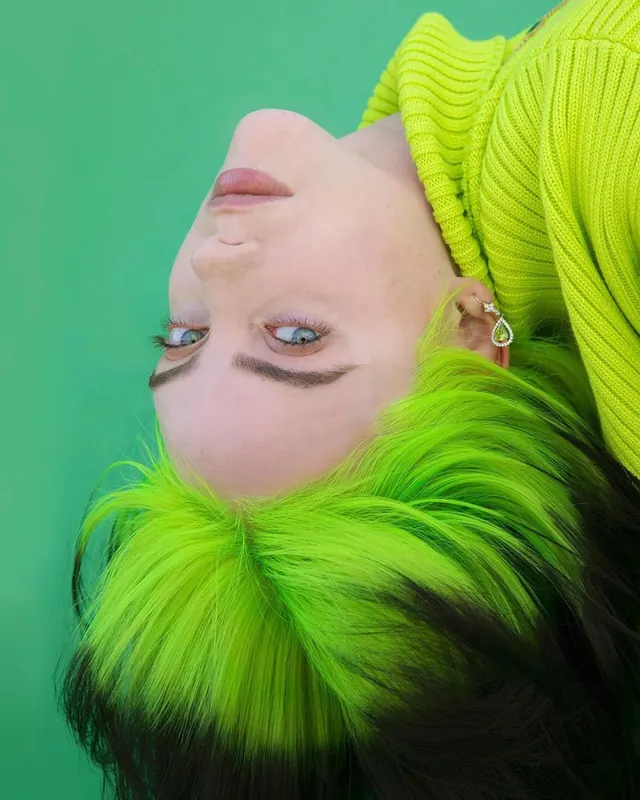 Upside-down neon-green portrait, editorial, photographic, vibrant