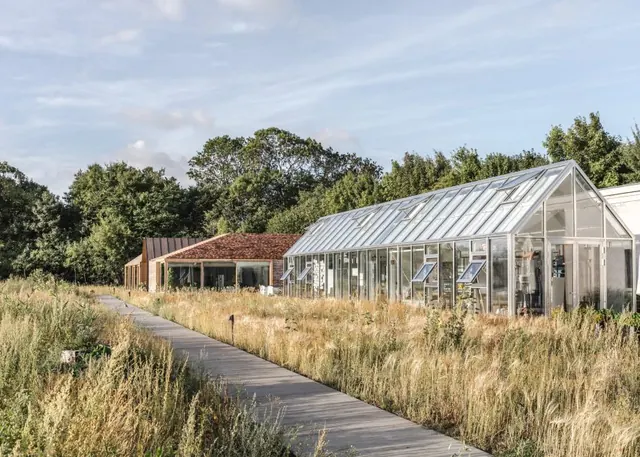 Modern Glass Pavilion in Meadow