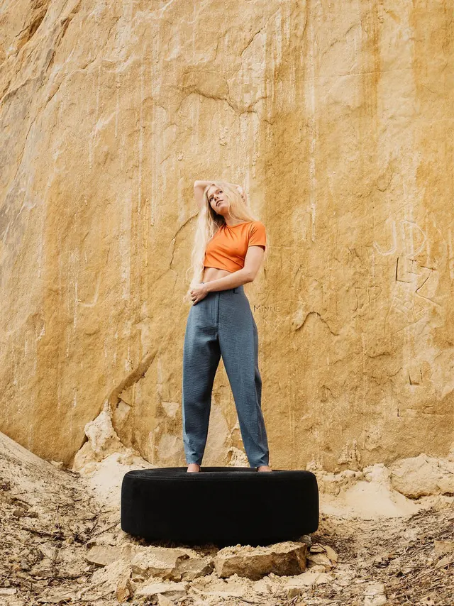 Woman Standing on Rock