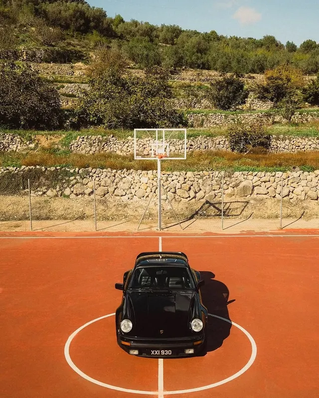 Vintage Car on Clay Court