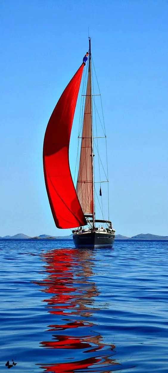 Red Sailboat on Blue Water