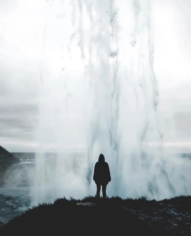 Person in Front of Waterfall