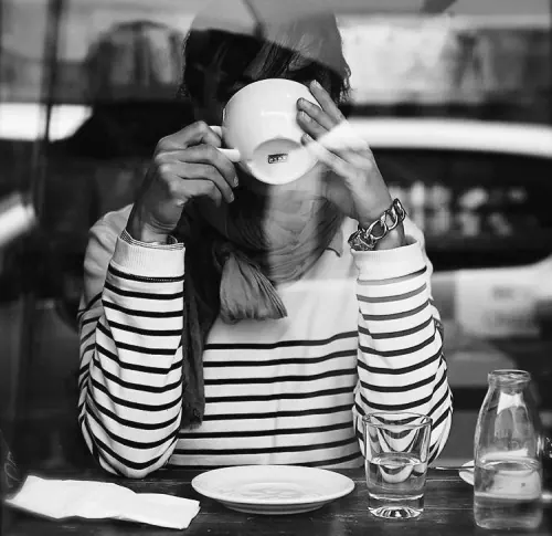 Black and White Portrait of Person with Coffee