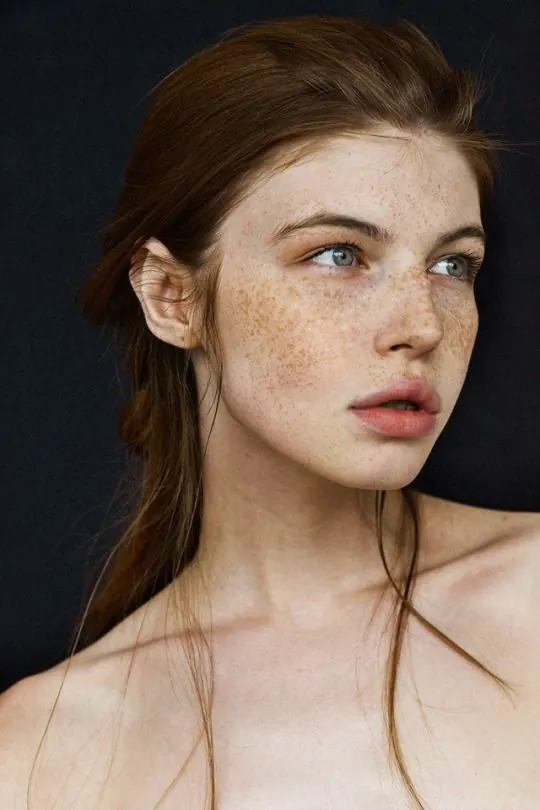 Portrait of a woman with freckles