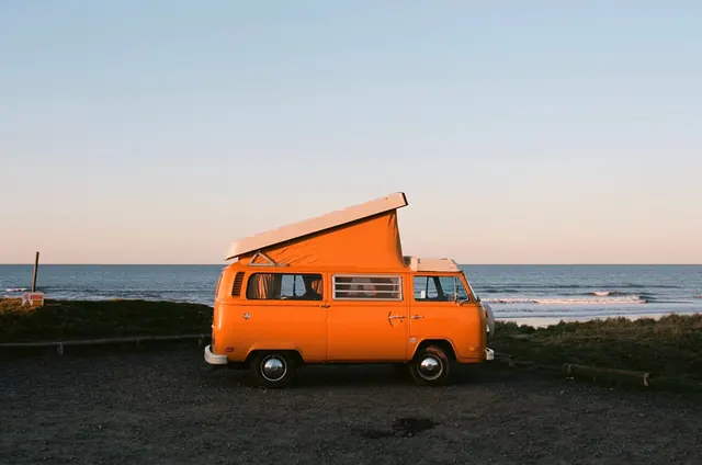 Orange Camper Van at Beach