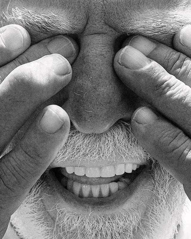 Close-up Portrait of Man Covering Eyes