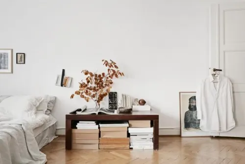 Minimal bedroom with dried foliage and books, minimal, photographic, light