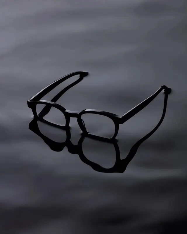 Black eyeglasses product shot with reflection, minimal, photographic, dark