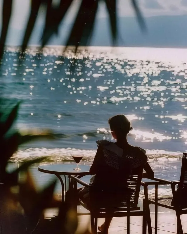 Person at Beachside Table
