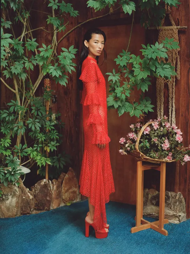 Woman in Red Dress in Garden