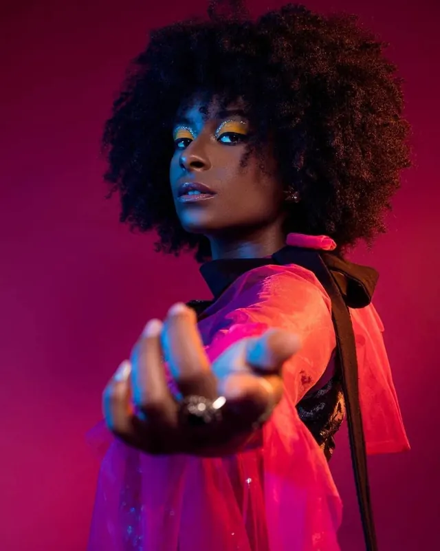 Portrait of a woman in pink lighting