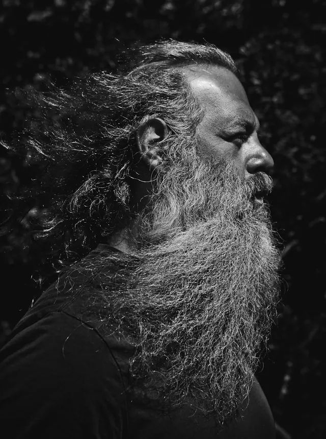 Black and White Portrait of a Man with Long Hair and Beard