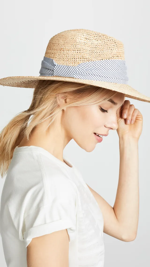 Mixed raffia straw hat with ribbon band, photographic, minimal, warm