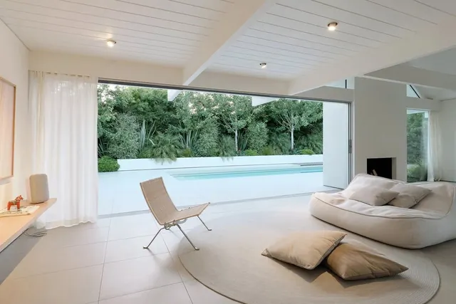 Minimalist poolside living space, minimal, corporate-clean, light