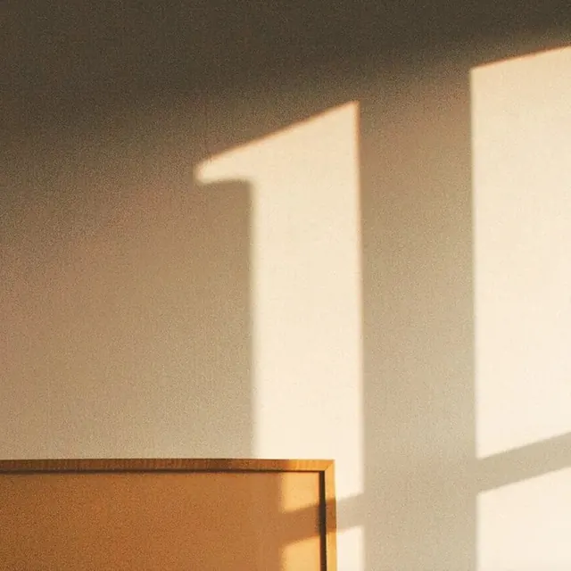 Window light and shadow study, photographic, minimal, warm