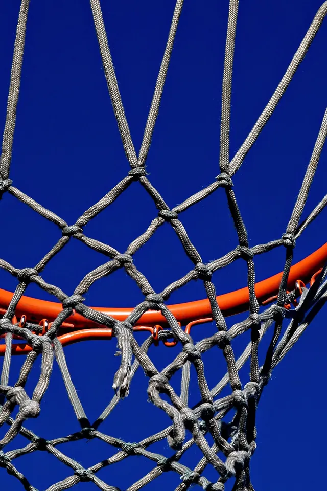 Basketball net against sky, photographic, geometric, dark