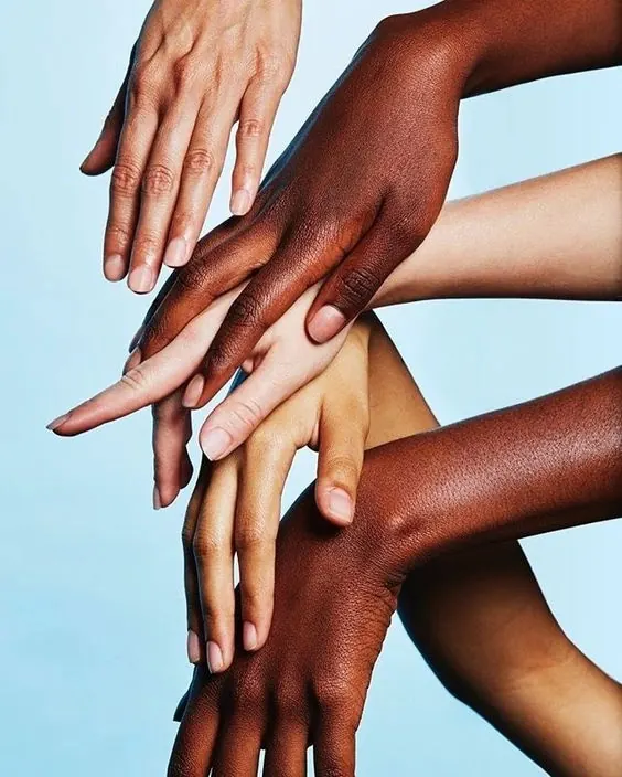Diverse hands stacked together, photographic, light