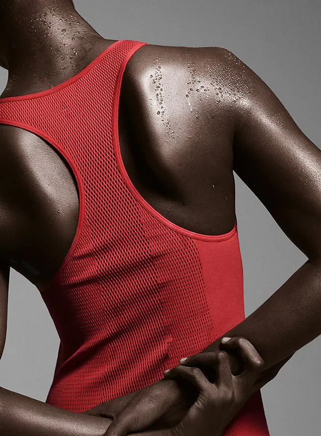 Nike Flyknit athletic wear close-up, photographic, minimal, warm
