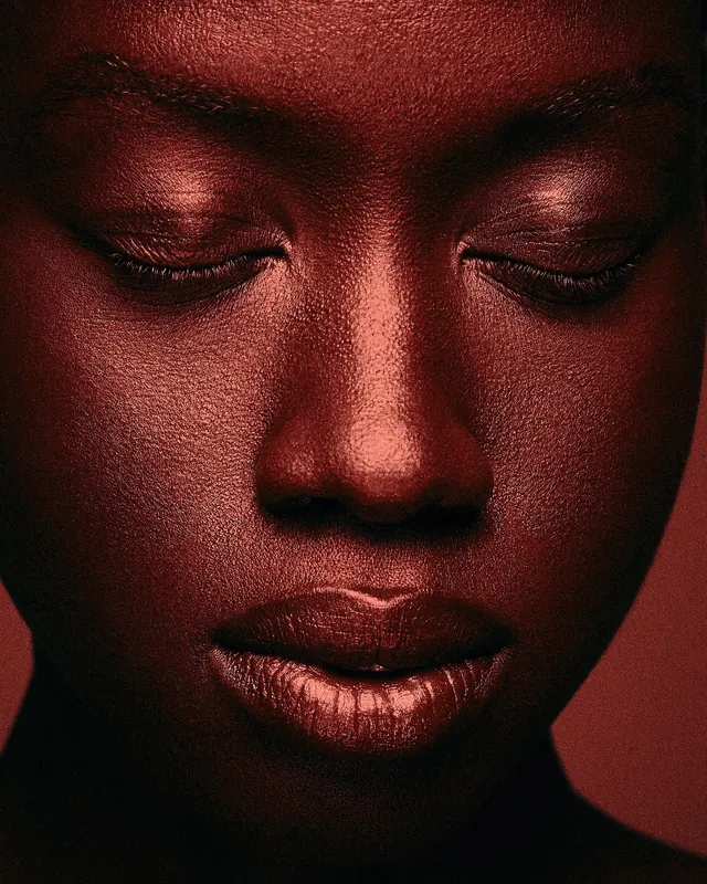 Portrait with deep red monochromatic lighting, photographic, dark-mode, dark