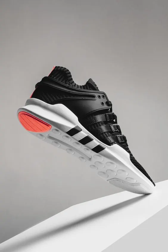 Adidas EQT athletic shoe hero shot, photographic, minimal, dark