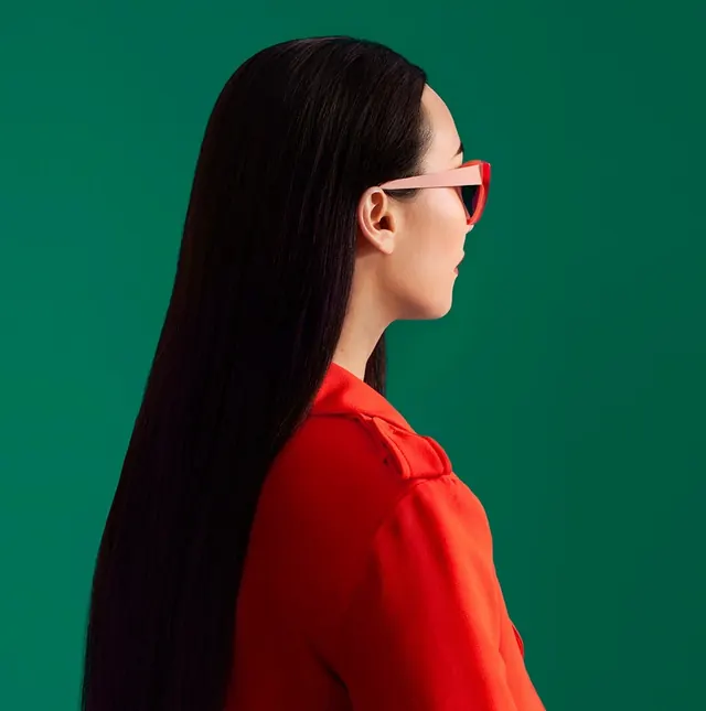 Fashion portrait with red sunglasses, photographic, minimal, high-contrast