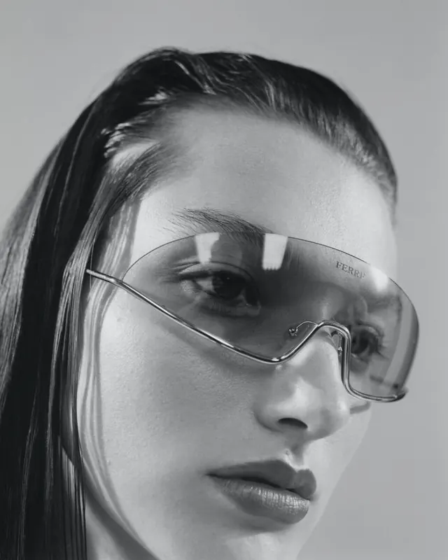 Woman wearing oversize geometric sunglasses, photographic, minimalist, monochrome