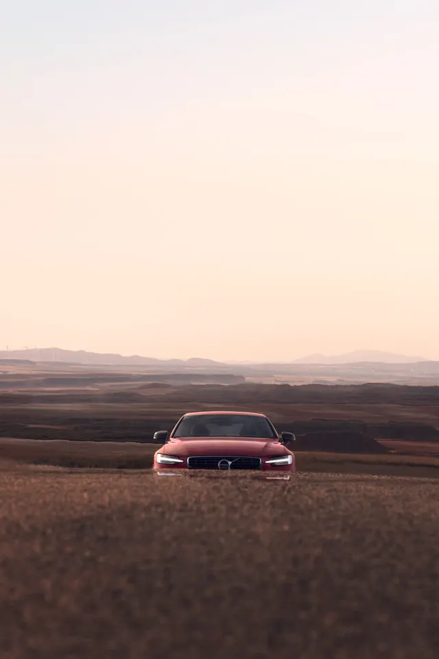 Volvo car photography desert landscape, photographic, minimalist, warm