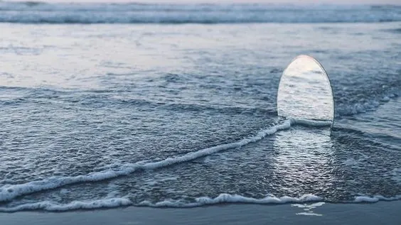 Surfboard in ocean waves at sunset, photographic, minimal, cool