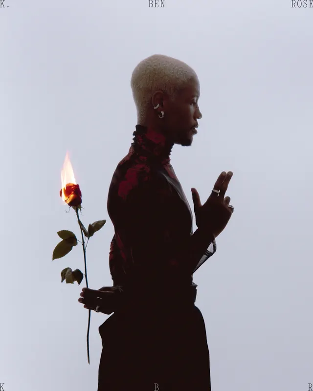 Editorial portrait with flaming rose, photographic, editorial, light