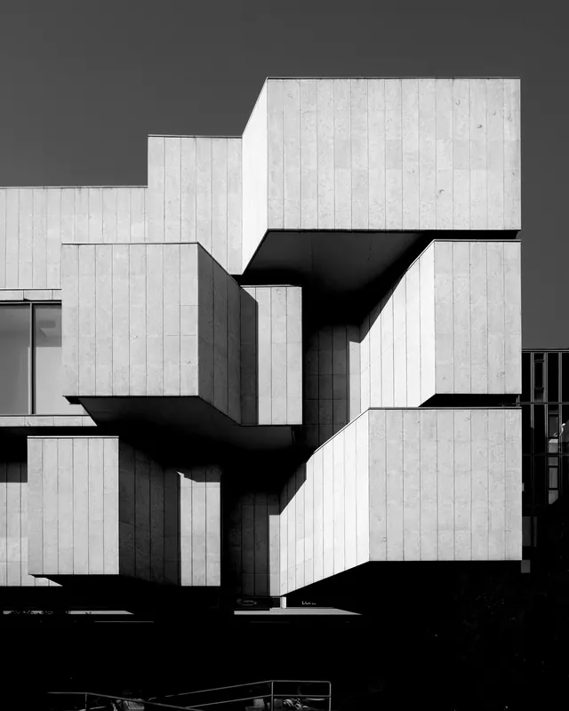 Brutalist concrete building facade, minimal, brutalist, dark