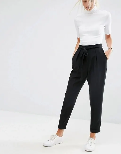 Model in White Top and Black Trousers
