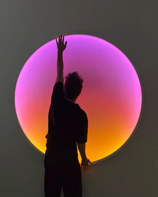 Silhouette against gradient sphere