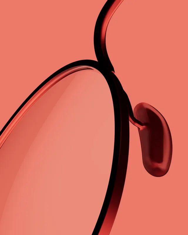 Translucent red glasses closeup, photographic, minimal, vibrant