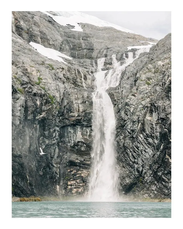 Waterfall in Mountain Landscape