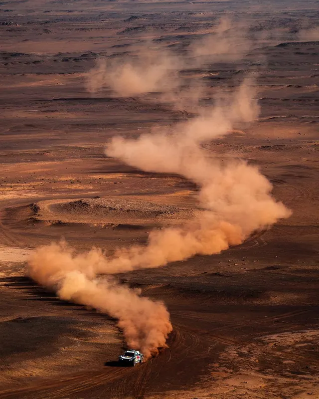 Off-road Vehicle in Desert Dust
