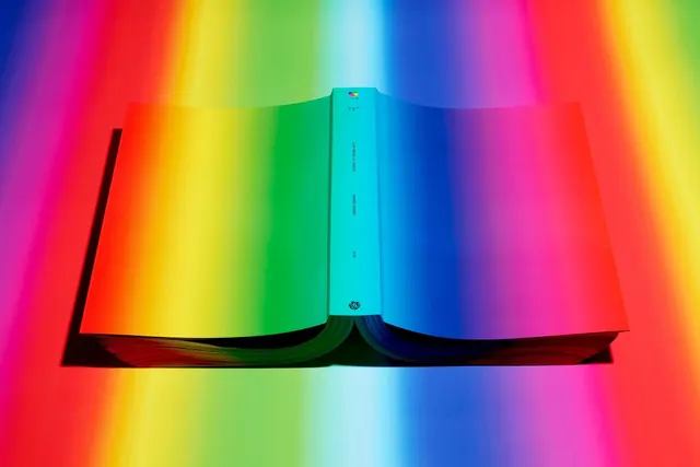 Rainbow color book spread, photographic, vibrant, vibrant