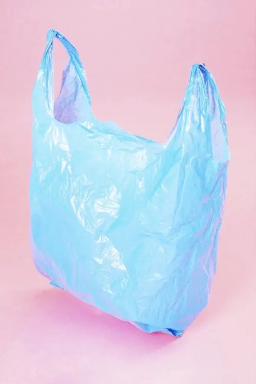 Blue Plastic Bag on Pink Background