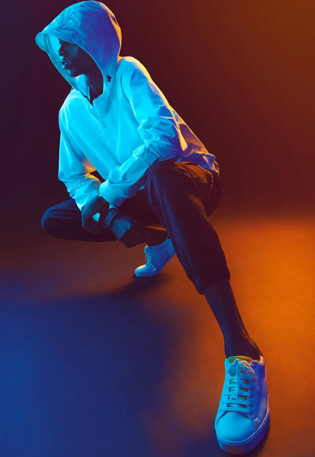 Hooded Figure in Neon Lighting