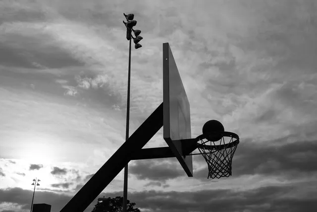 Basketball Hoop in Cloudy Sky