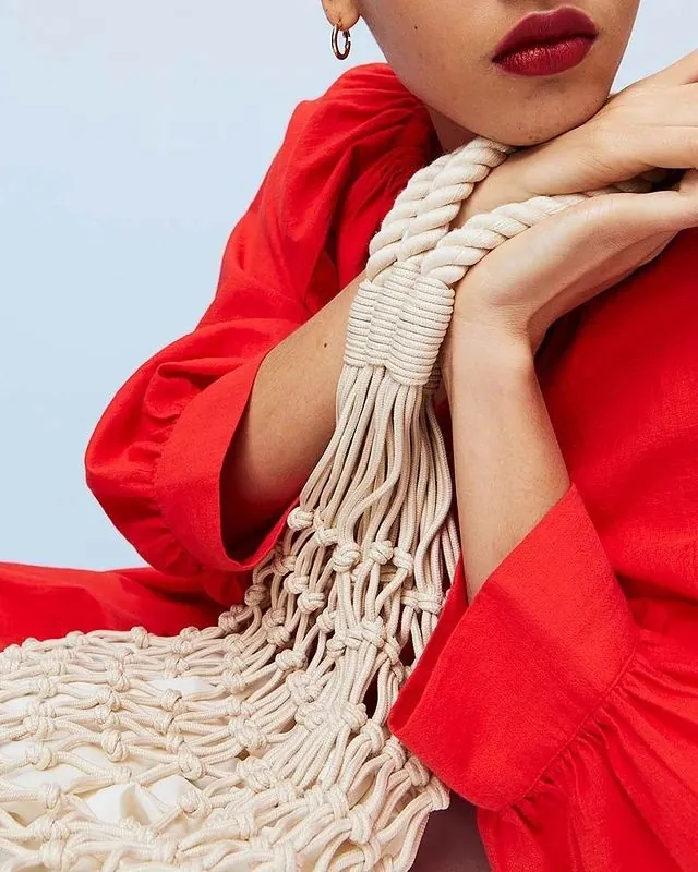Woman in Red Garment with Macramé Detail