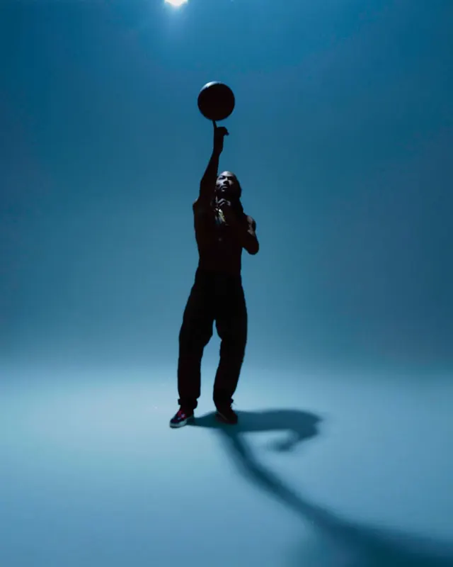Silhouette Figure with Sphere