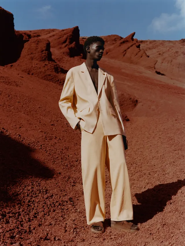 Model in Red Sand Landscape