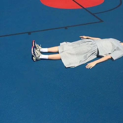 Person Lying on Blue Surface