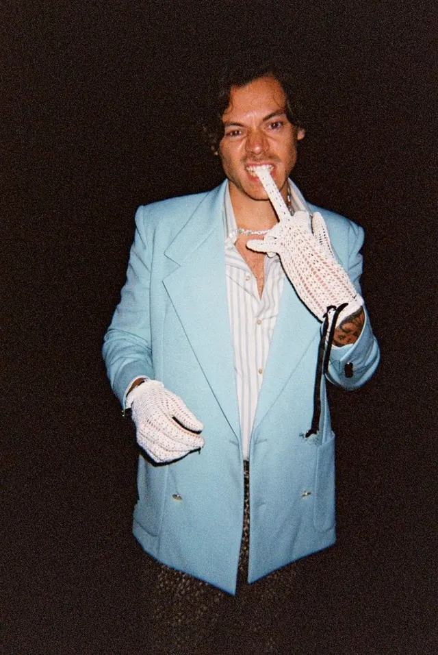 Man in Blue Suit with White Gloves