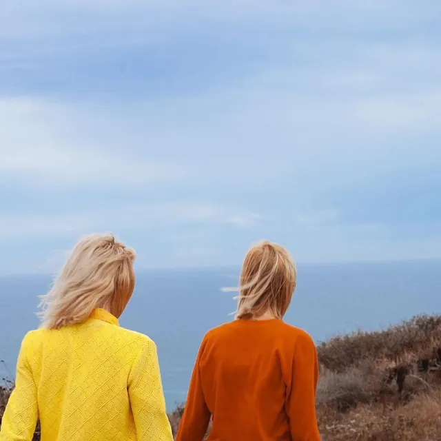 Two women looking at the ocean