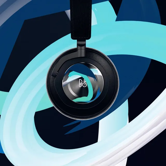 Black headphones with teal graphic background, photographic, minimal, dark