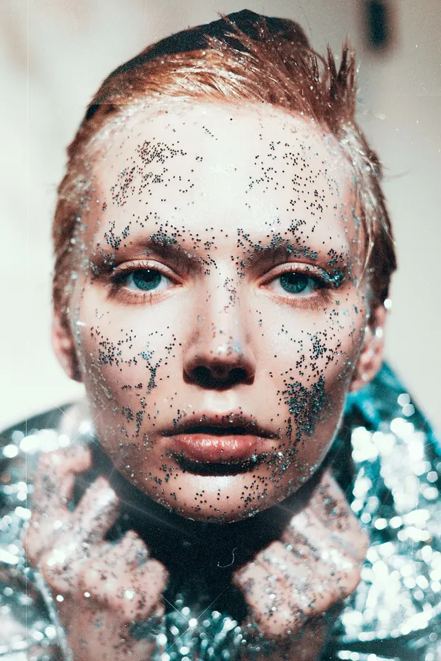 Portrait with glitter makeup and foil, photographic, light