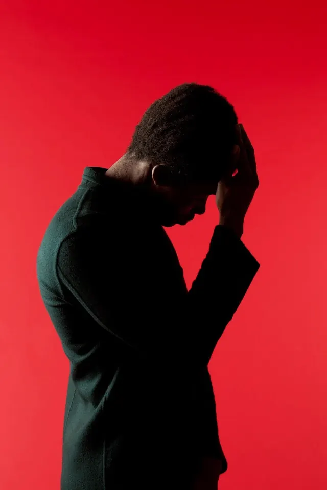 Silhouette Portrait against Red Background