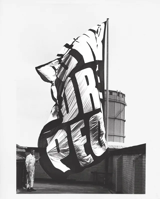 Large-scale sculptural typography installation, photographic, bold, monochrome